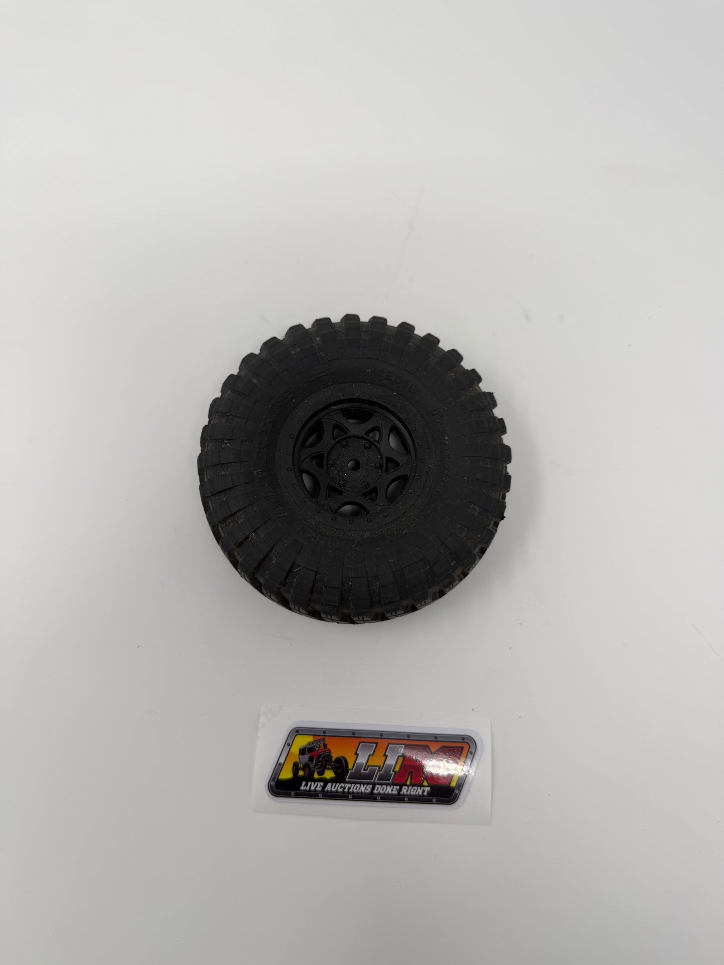 Axial 4.6" Treppador glued to a plastic 1.9 wheel
