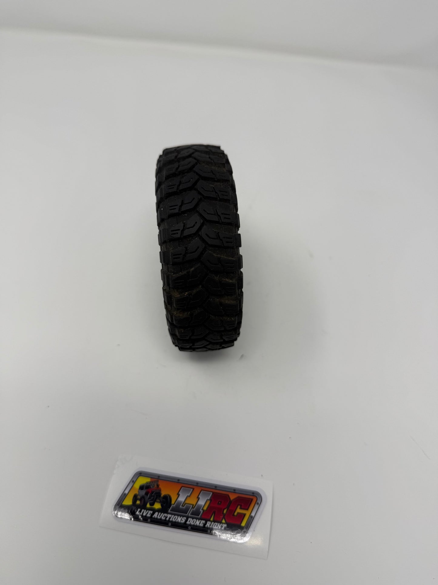 Axial 4.6" Treppador glued to a plastic 1.9 wheel